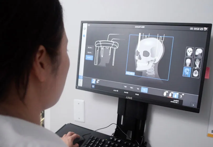 Alexandria, VA dentist Dr. Shine reviewing a patient's x-rays at U Shine Dental