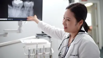 Dr. Shin reviewing a patient's dental x-rays at U Shine Dental in Alexandria, VA